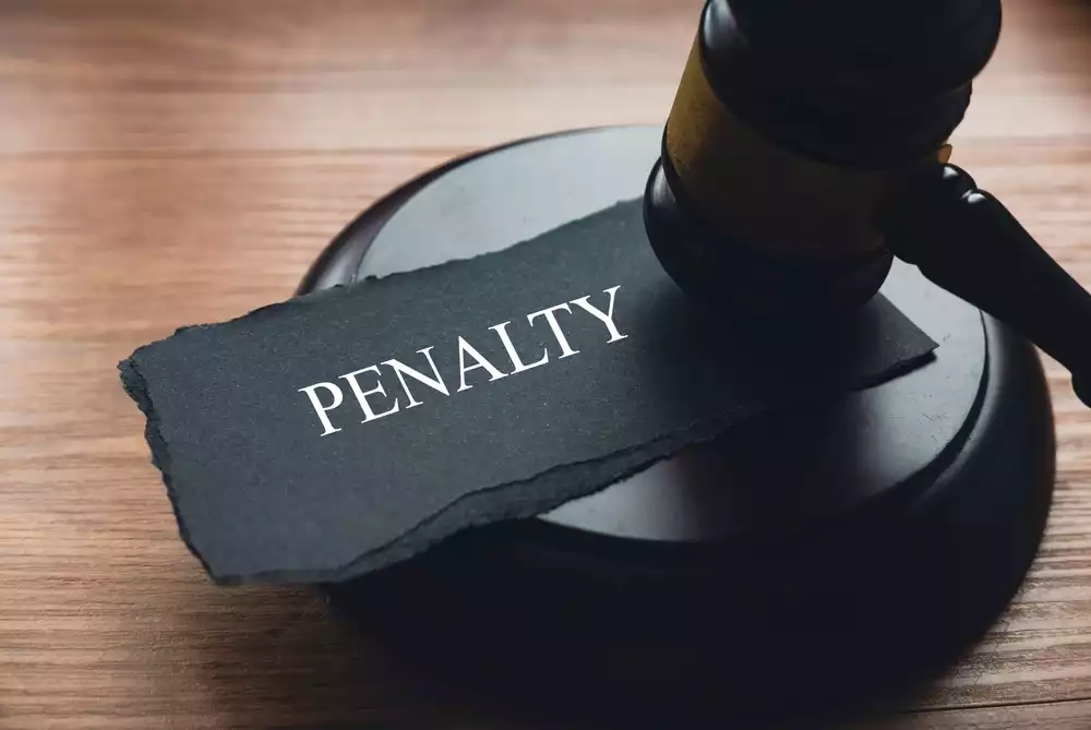 “Penalty” written on slate next to a gavel